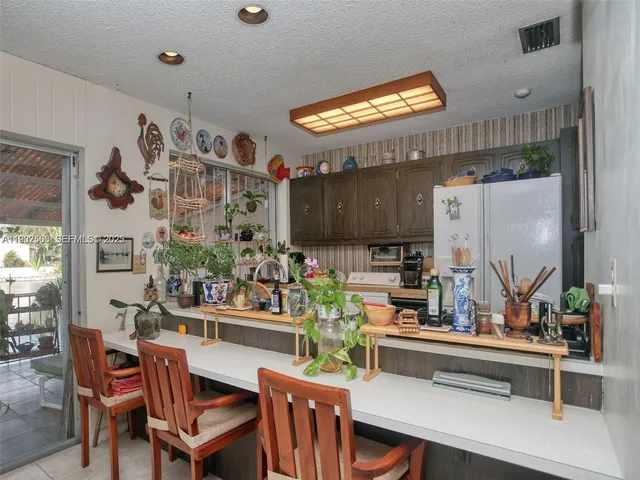 a kitchen with a table and chairs in it