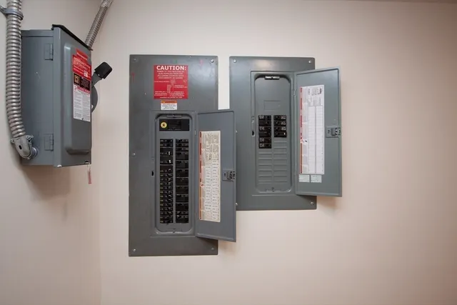 a view of a house with a yard covered in snow