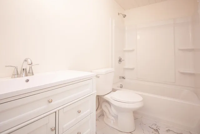 a bathroom with a sink a toilet and a bathtub