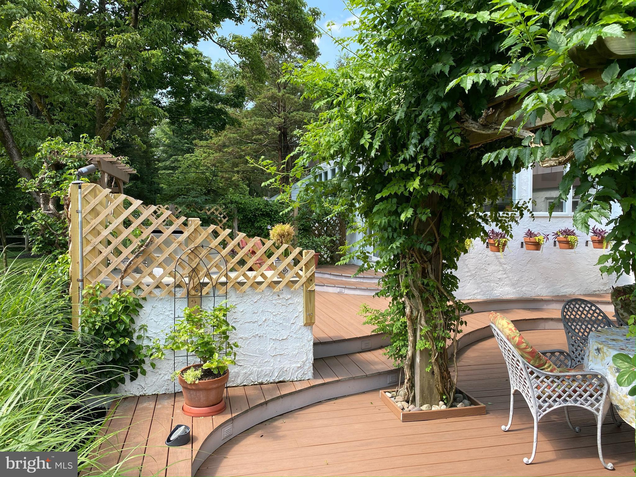 14 Jonathan Way Washington Crossing, PA 18977 - Photo 43 of 58 Outdoor Dining with Trumpet Vine covered pergola