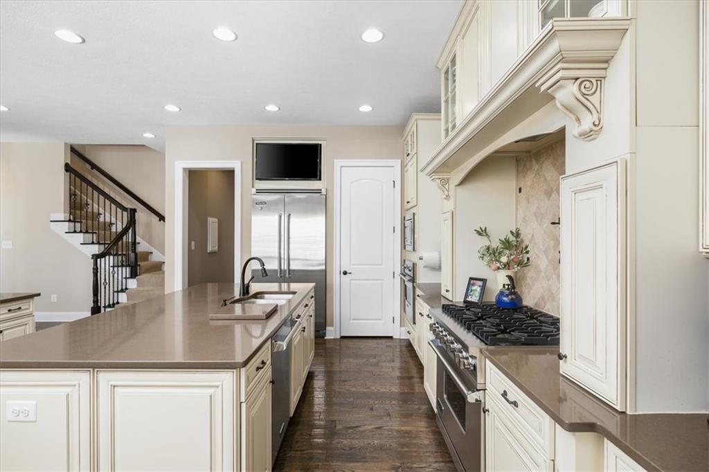 102 Minnock Drive Mars, PA 16046 - Photo 16 of 50 a kitchen with stainless steel appliances granite countertop a sink stove and refrigerator