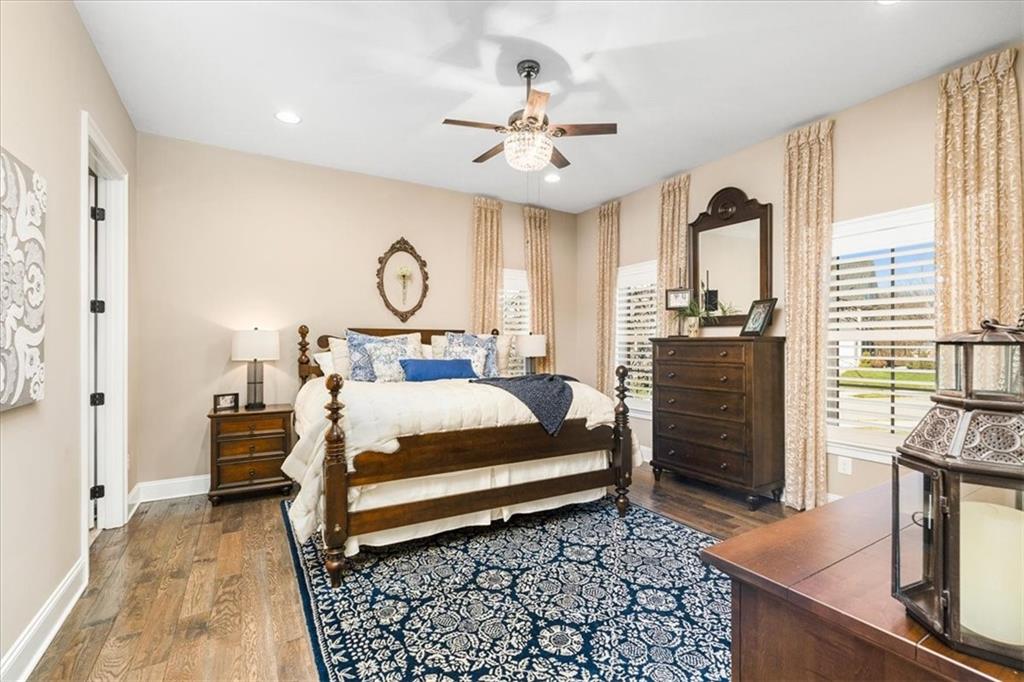 102 Minnock Drive Mars, PA 16046 - Photo 20 of 50 a bedroom with a bed and dresser with wooden floor