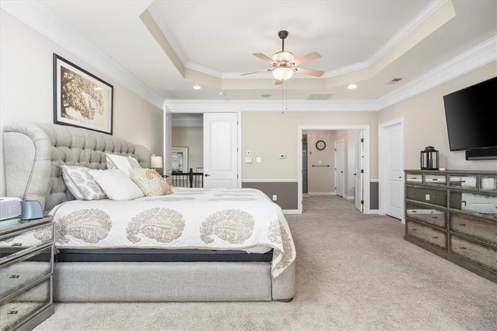 102 Minnock Drive Mars, PA 16046 - Photo 27 of 50 a spacious bedroom with a large bed and flat tv screen