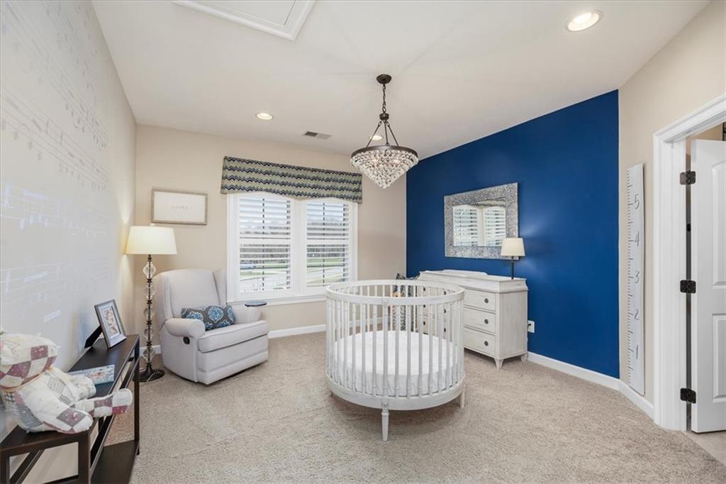 102 Minnock Drive Mars, PA 16046 - Photo 32 of 50 a bedroom with furniture and a chandelier