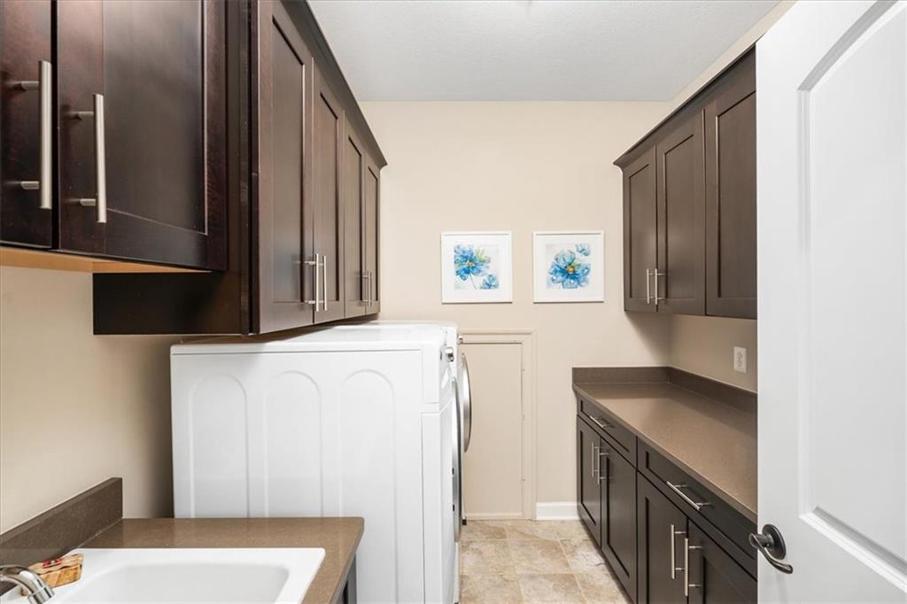 102 Minnock Drive Mars, PA 16046 - Photo 36 of 50 a kitchen with a refrigerator and a stove