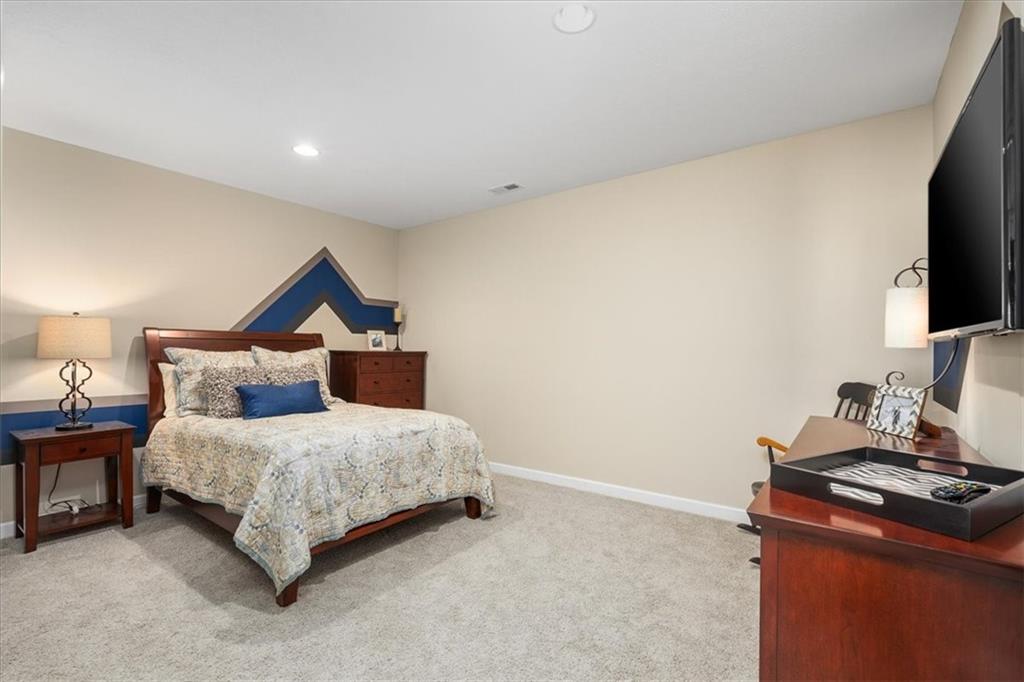 102 Minnock Drive Mars, PA 16046 - Photo 42 of 50 a bedroom with a bed and a flat screen tv