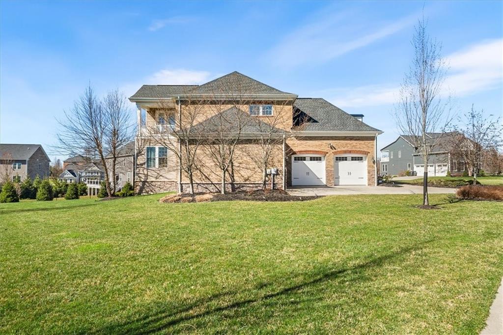 102 Minnock Drive Mars, PA 16046 - Photo 47 of 50 a front view of a house with a garden