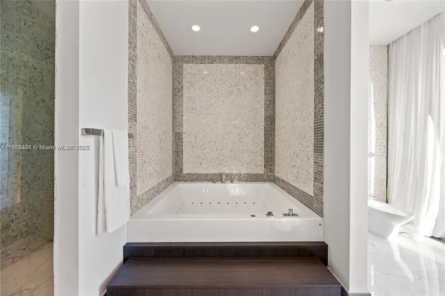 a bed room with a bed and a painting on the wall