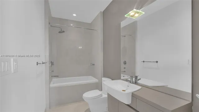 a bedroom with a bed and a potted plant