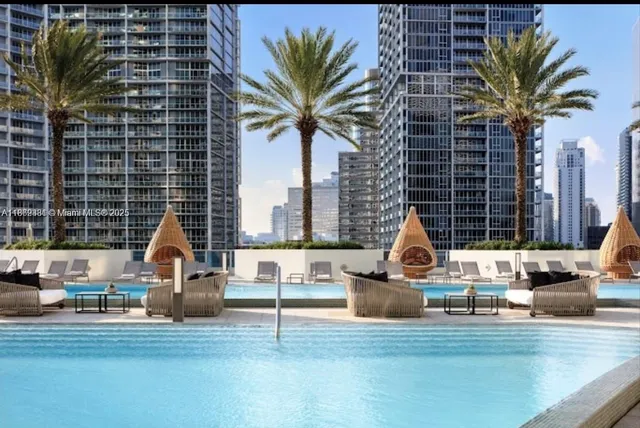 a view of front door with table and chairs