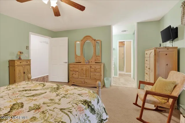 a bathroom with a sink a vanity a mirror and a shower