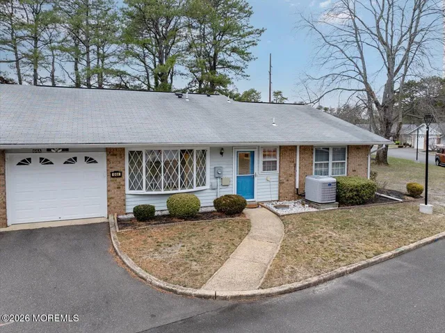 front view of a house with a garden