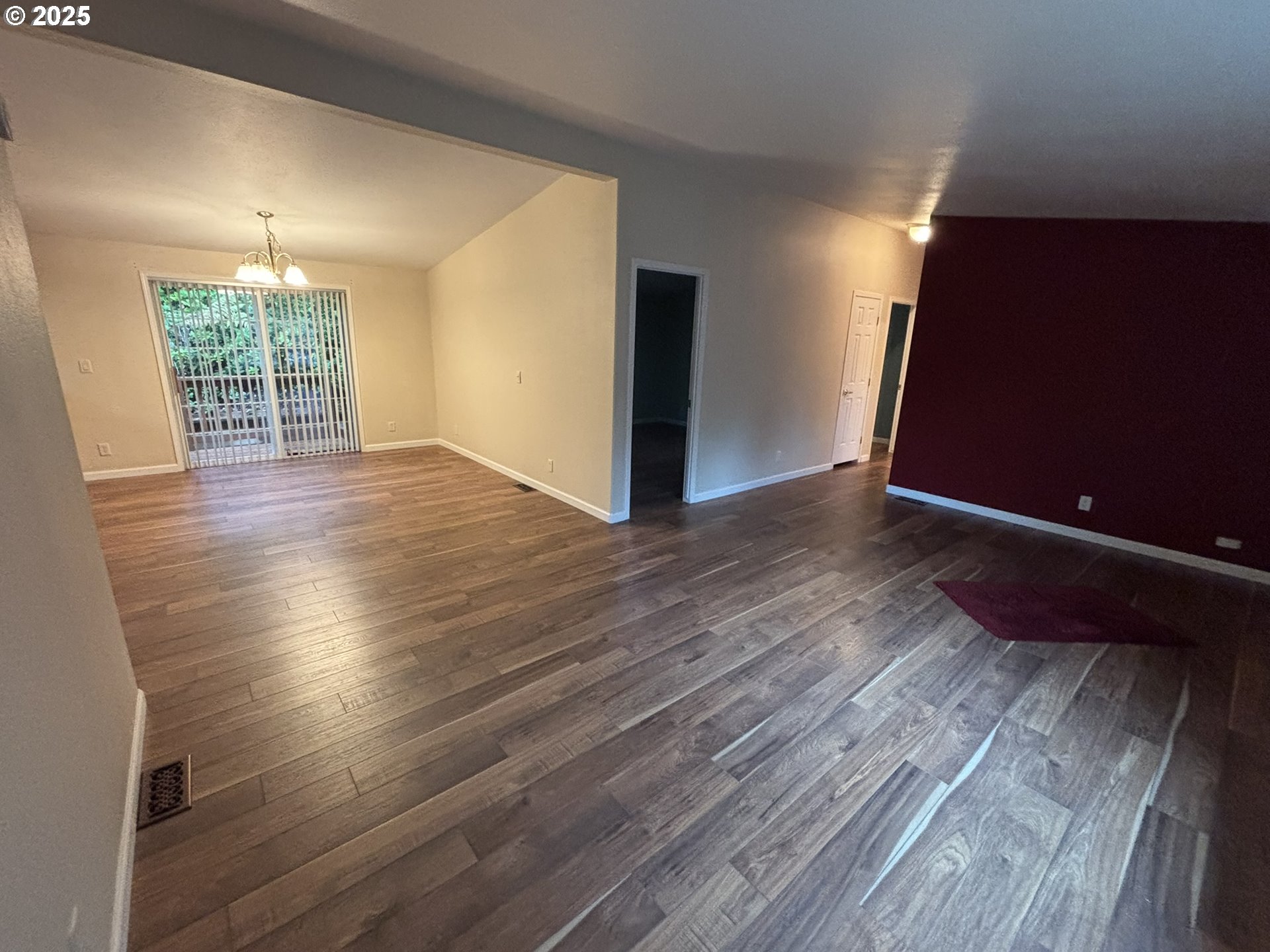 325 Jonathan Lane Florence, OR 97439 - Photo 15 of 37 an empty room with wooden floor and windows