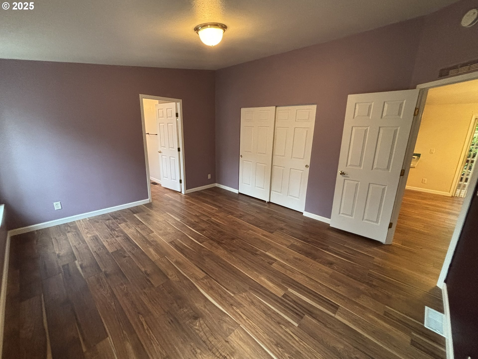 325 Jonathan Lane Florence, OR 97439 - Photo 18 of 37 a view of an empty room with wooden floor and a window