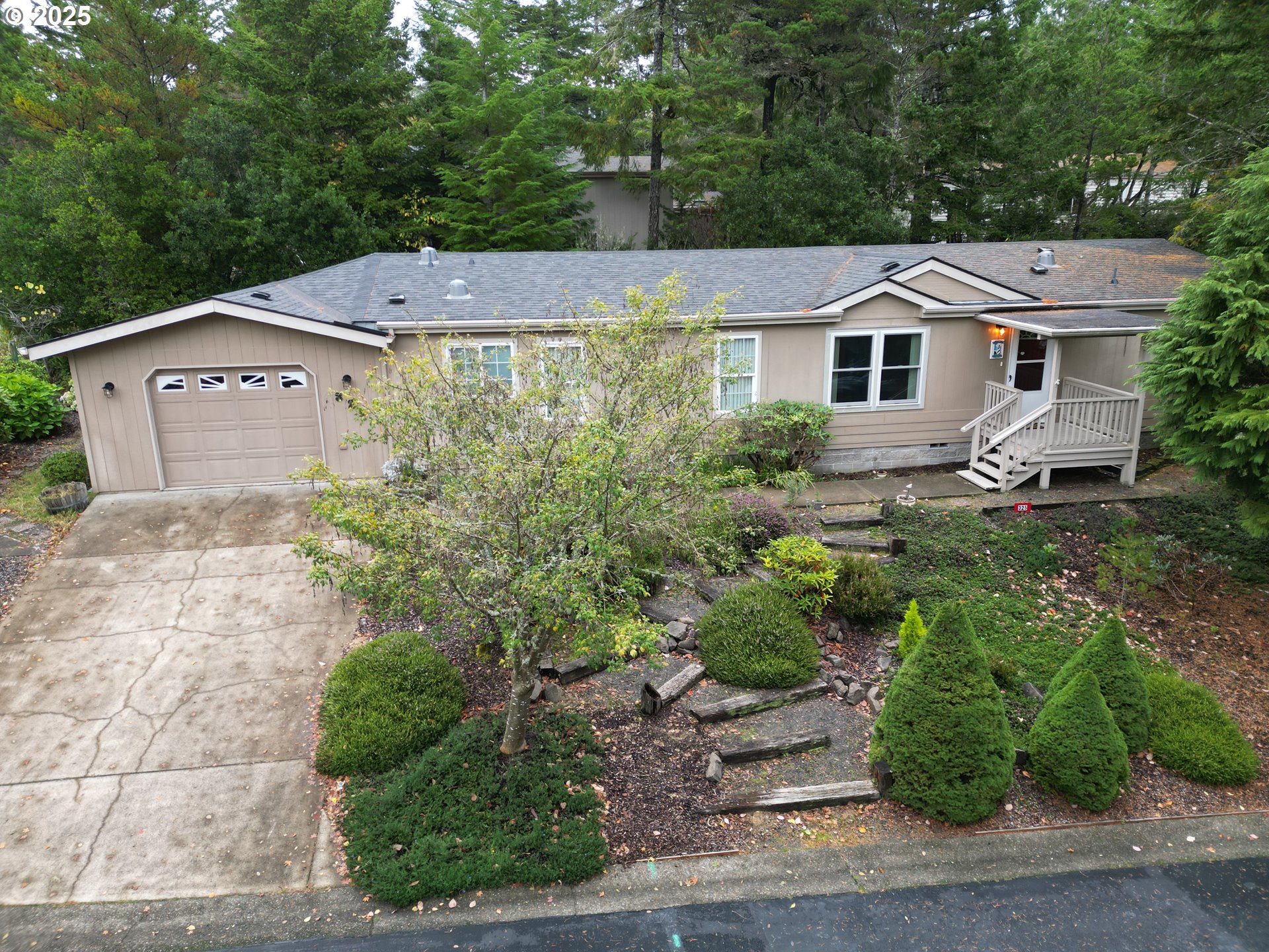 325 Jonathan Lane Florence, OR 97439 - Photo 2 of 37 a aerial view of a house with a yard