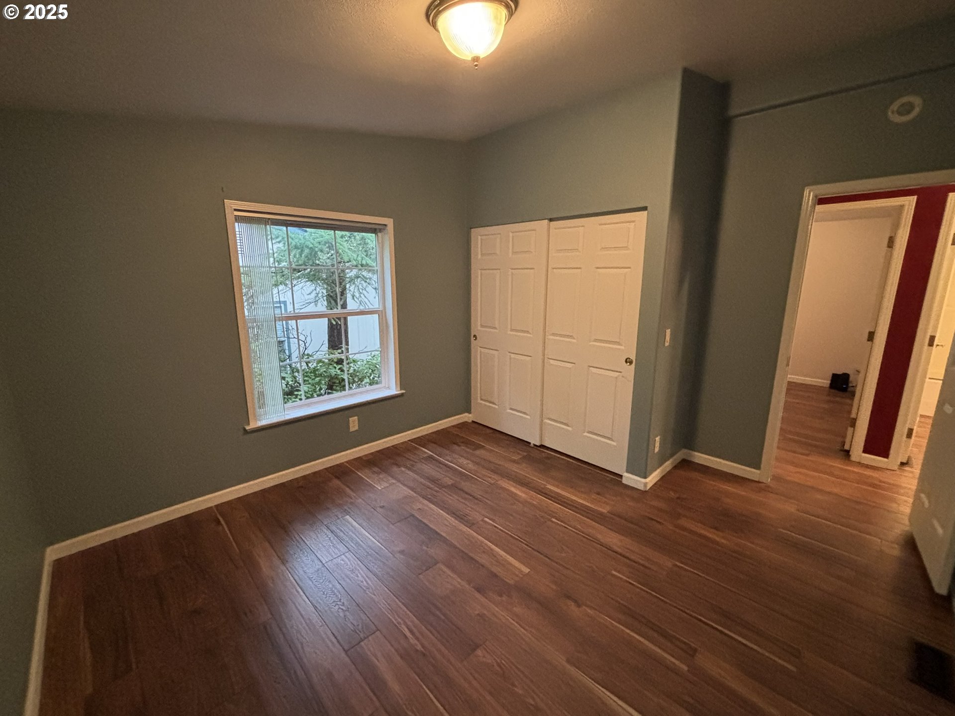325 Jonathan Lane Florence, OR 97439 - Photo 25 of 37 an empty room with wooden floor and windows