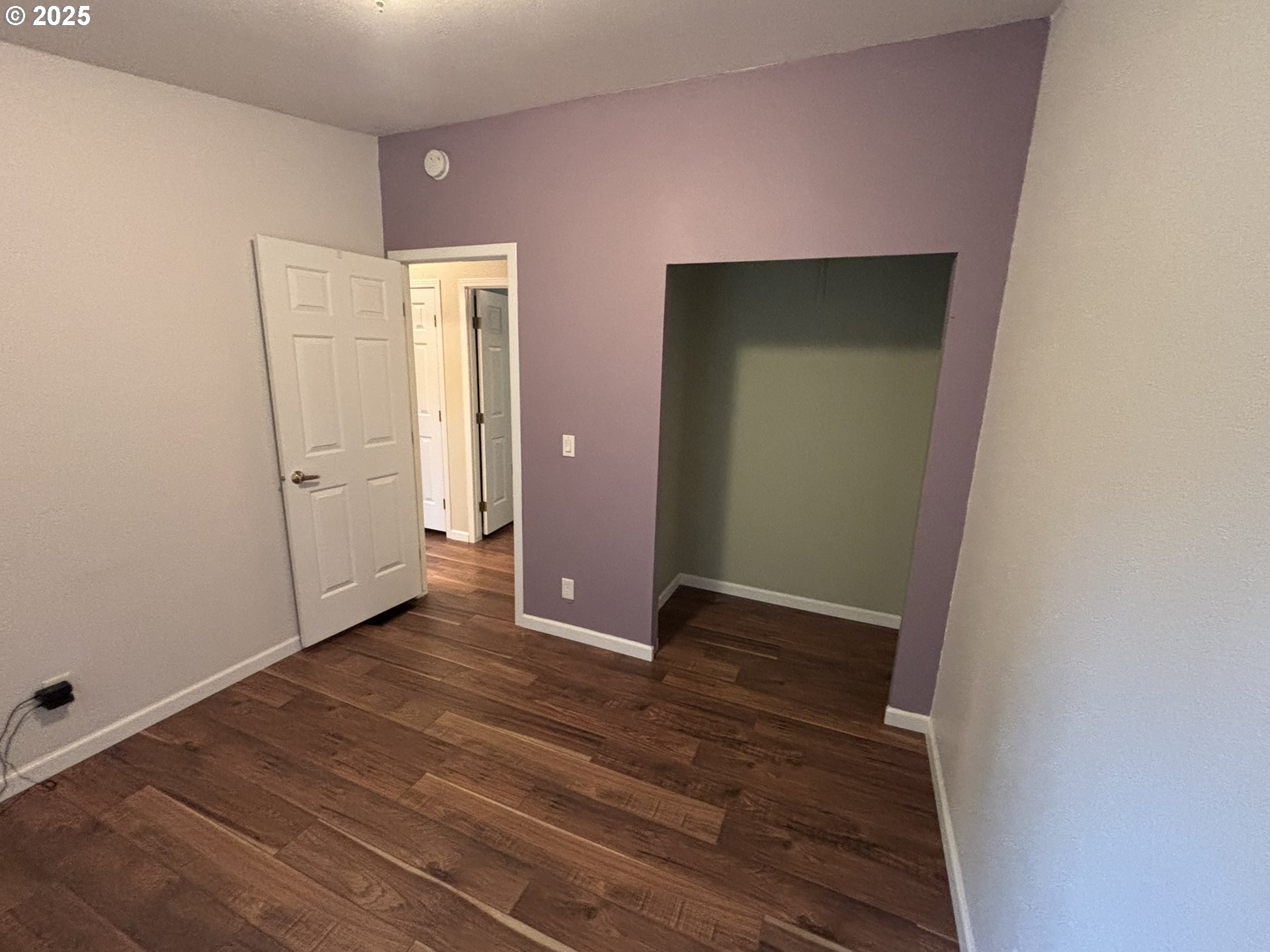 325 Jonathan Lane Florence, OR 97439 - Photo 27 of 37 a view of an empty room with closet and wooden floor