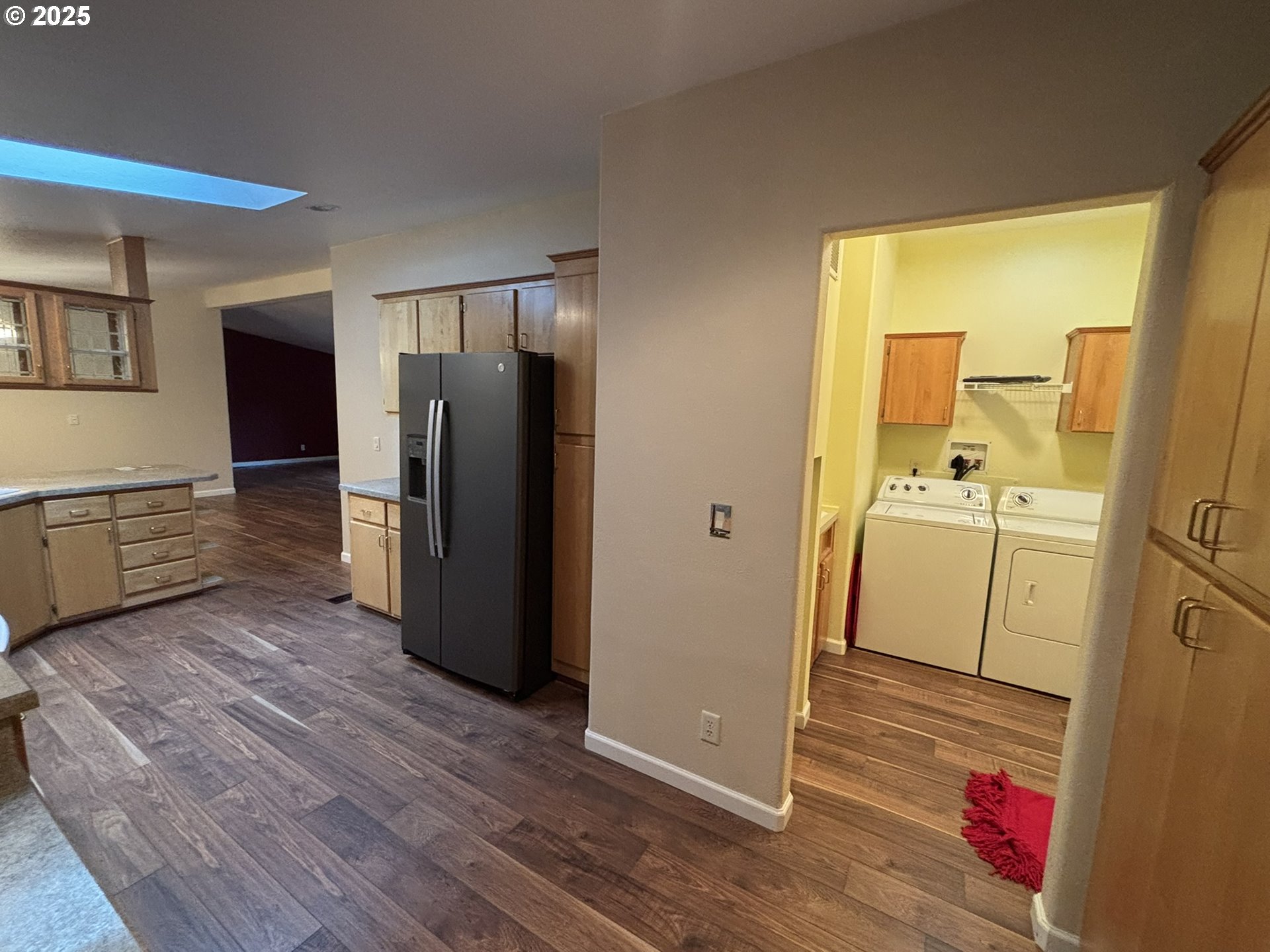 325 Jonathan Lane Florence, OR 97439 - Photo 10 of 37 a view of a kitchen with refrigerator and wooden floor