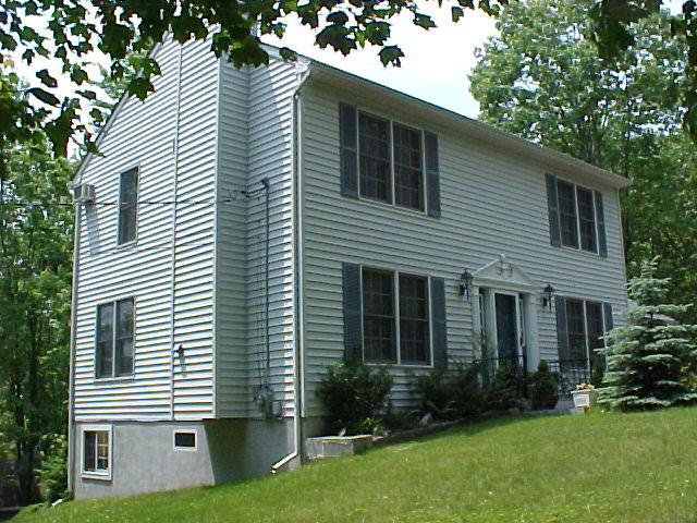 29 Holly Forest Road Mount Pocono, PA 18344 - Photo 2 of 14 a view of a house with a yard and plants