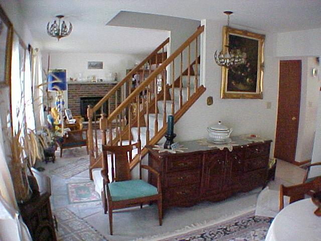 29 Holly Forest Road Mount Pocono, PA 18344 - Photo 10 of 14 a living room with lots of furniture and stairs