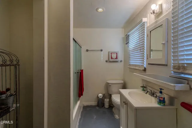 813 West Broadway Street Needles, CA 92363 - Photo 11 of 27 a bathroom with a sink toilet and shower