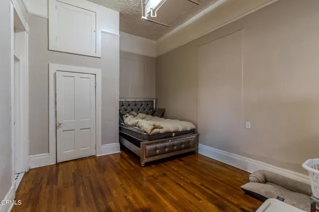 813 West Broadway Street Needles, CA 92363 - Photo 14 of 27 a bedroom with a bed and a table in it