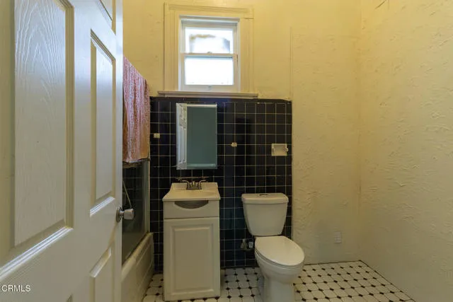 813 West Broadway Street Needles, CA 92363 - Photo 16 of 27 a bathroom with a toilet and a sink