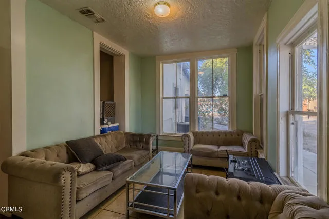 813 West Broadway Street Needles, CA 92363 - Photo 17 of 27 a living room with furniture and a large window