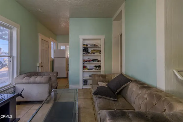 813 West Broadway Street Needles, CA 92363 - Photo 18 of 27 a living room with furniture and a couch