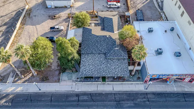 813 West Broadway Street Needles, CA 92363 - Photo 2 of 27 an aerial view of a house with outdoor space