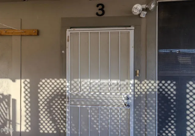 813 West Broadway Street Needles, CA 92363 - Photo 3 of 27 a view of wooden door