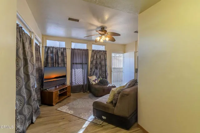 813 West Broadway Street Needles, CA 92363 - Photo 4 of 27 a living room with furniture and a flat screen tv