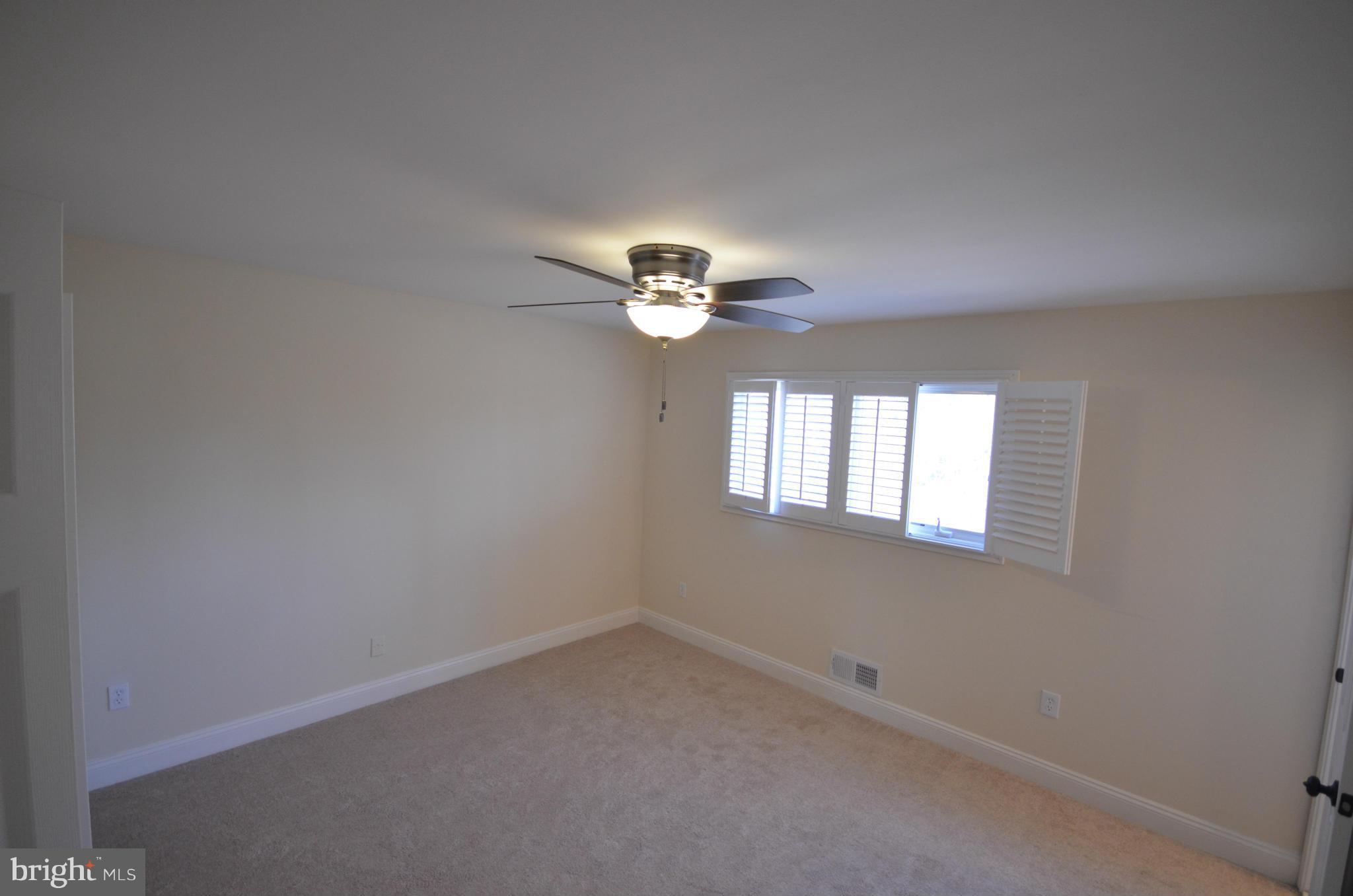 6405 Darwin Road Laurel, MD 20707 - Photo 12 of 20 an empty room that has a window