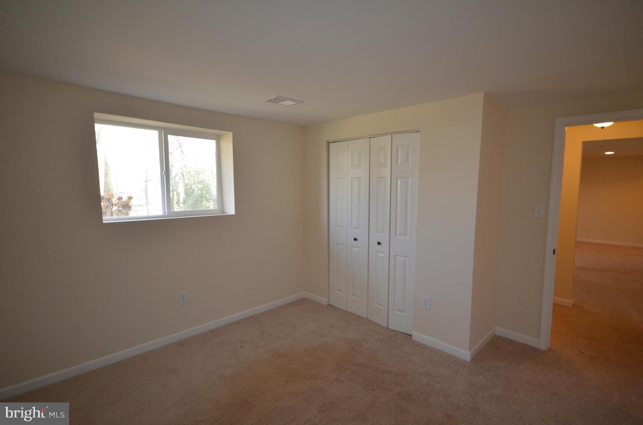 6405 Darwin Road Laurel, MD 20707 - Photo 15 of 20 a view of an empty room with a window