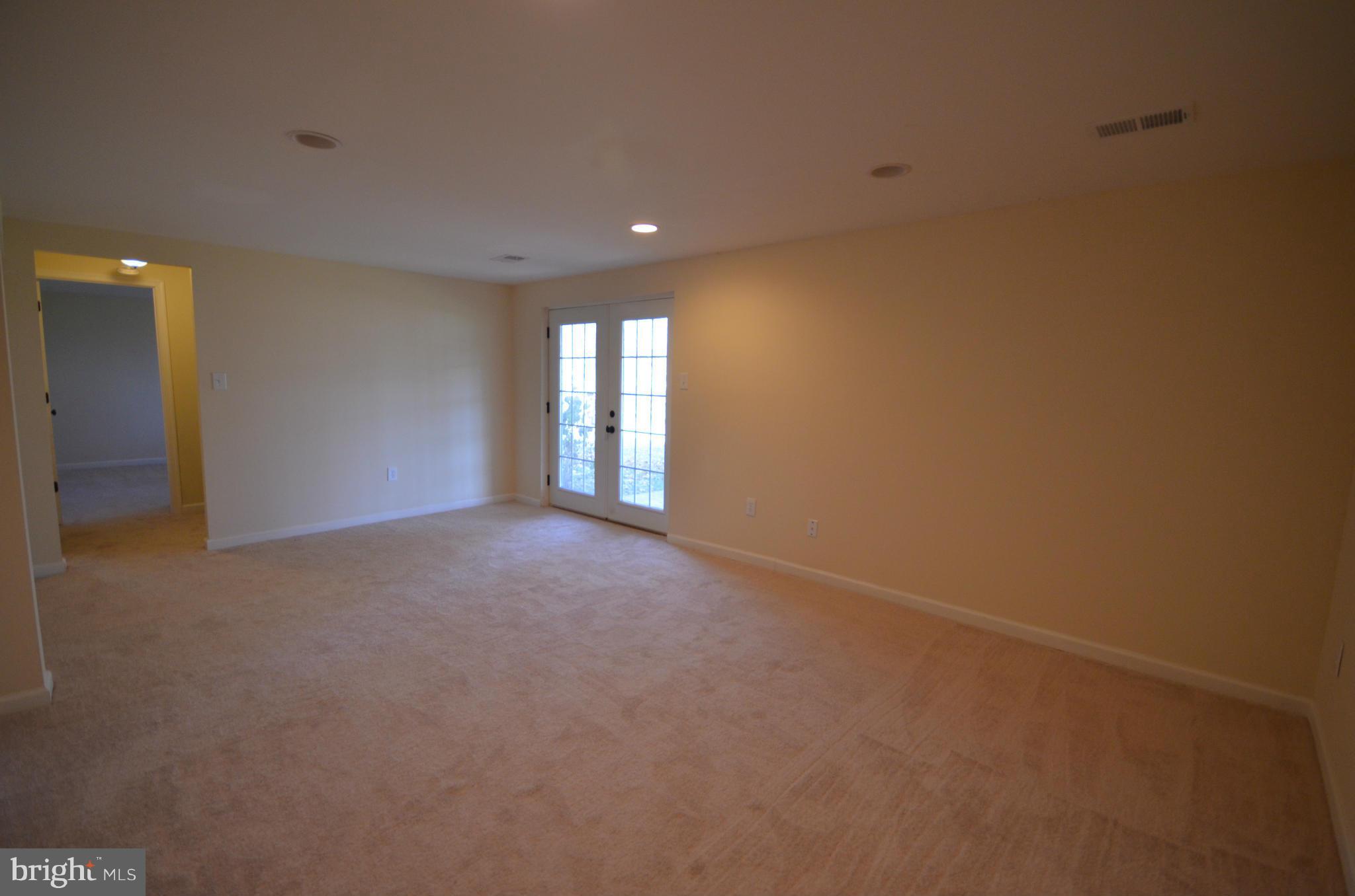 6405 Darwin Road Laurel, MD 20707 - Photo 18 of 20 a view of an empty room with a window