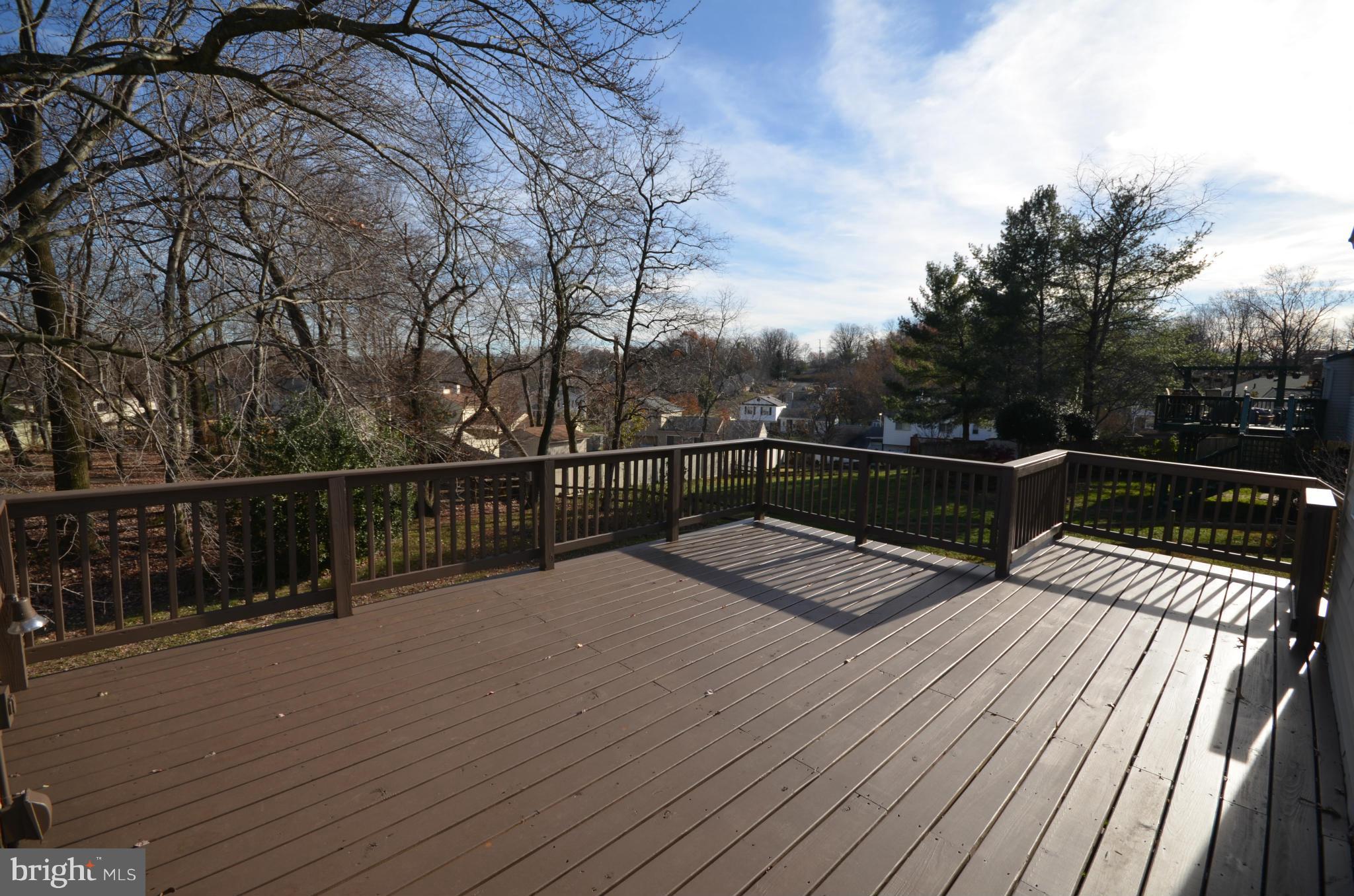 6405 Darwin Road Laurel, MD 20707 - Photo 8 of 20 a view of balcony with wooden floor and fence