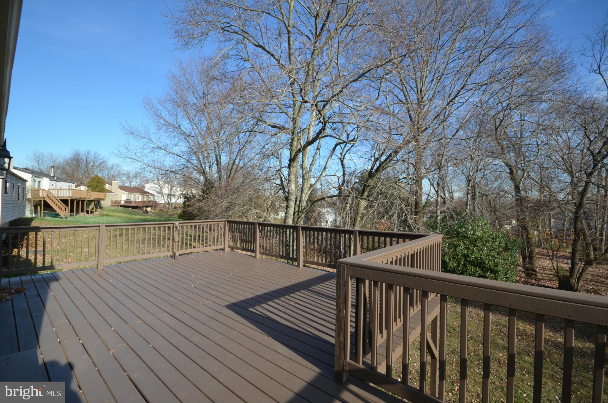 6405 Darwin Road Laurel, MD 20707 - Photo 9 of 20 a view of river and deck with large trees