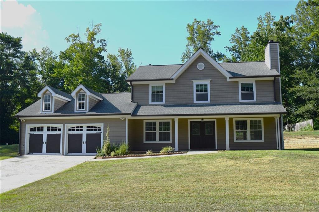 front view of a house with a yard