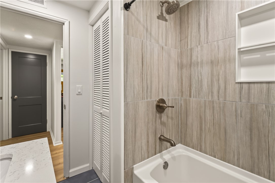 355 Falstaff Road Irondequoit, NY 14609 - Photo 20 of 27 New tile flooring & shower surround with modern sh