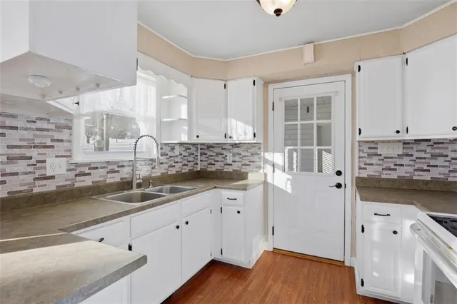 a kitchen with a sink and cabinets