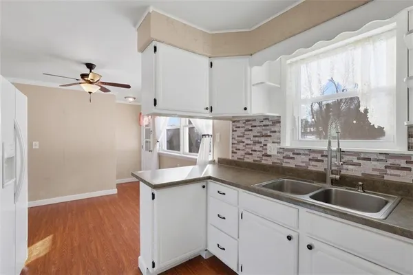 a kitchen with a stove and a refrigerator