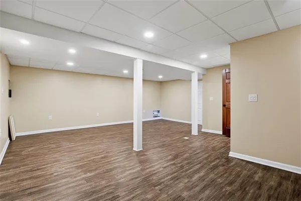 a bathroom with a shower a toilet and sink