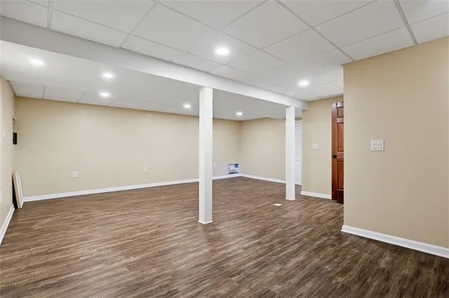 a bathroom with a shower a toilet and sink