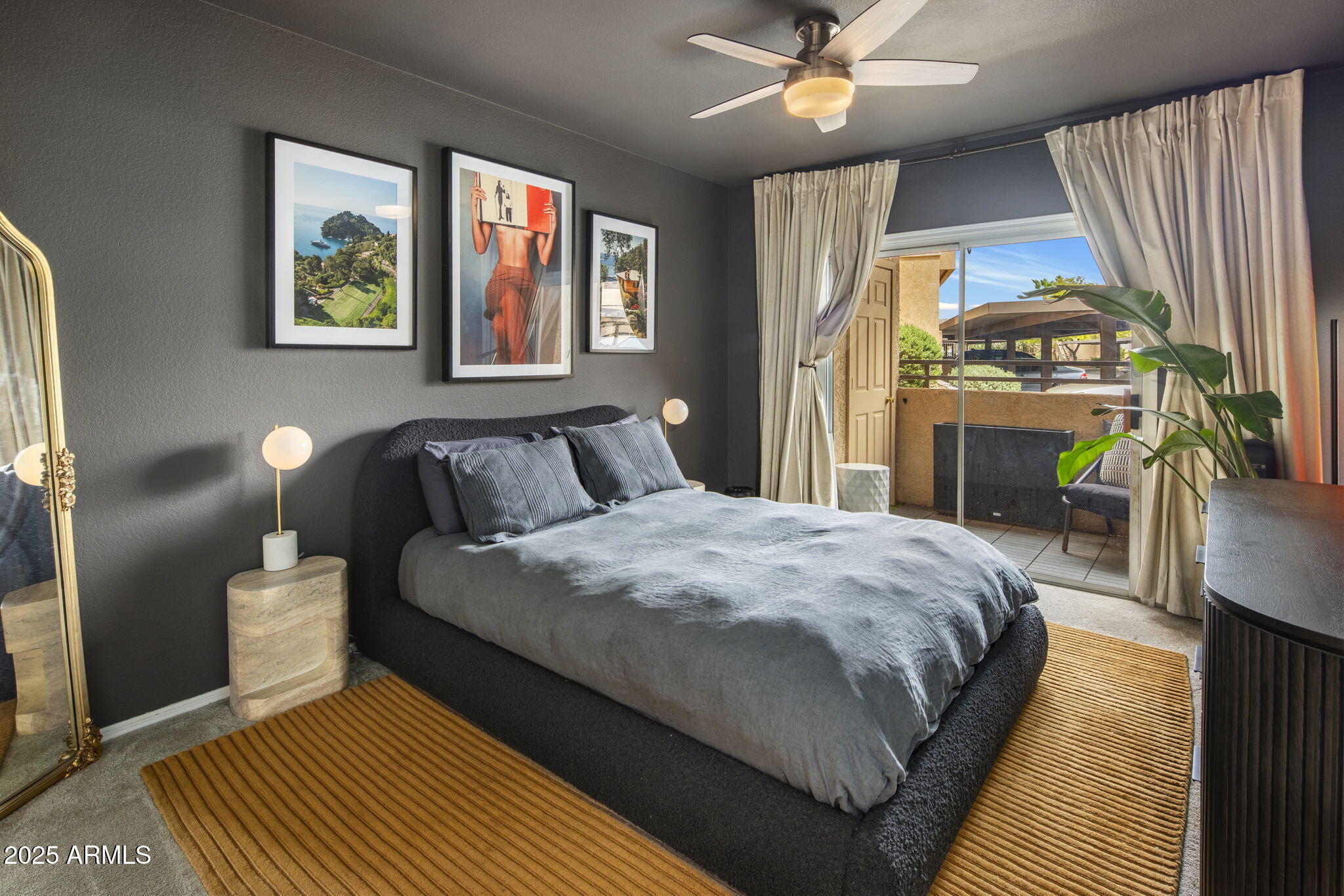 10410 North Cave Creek Road, Unit 1115 Phoenix, AZ 85020 - Photo 1 of 19 a bedroom with a bed and a chandelier