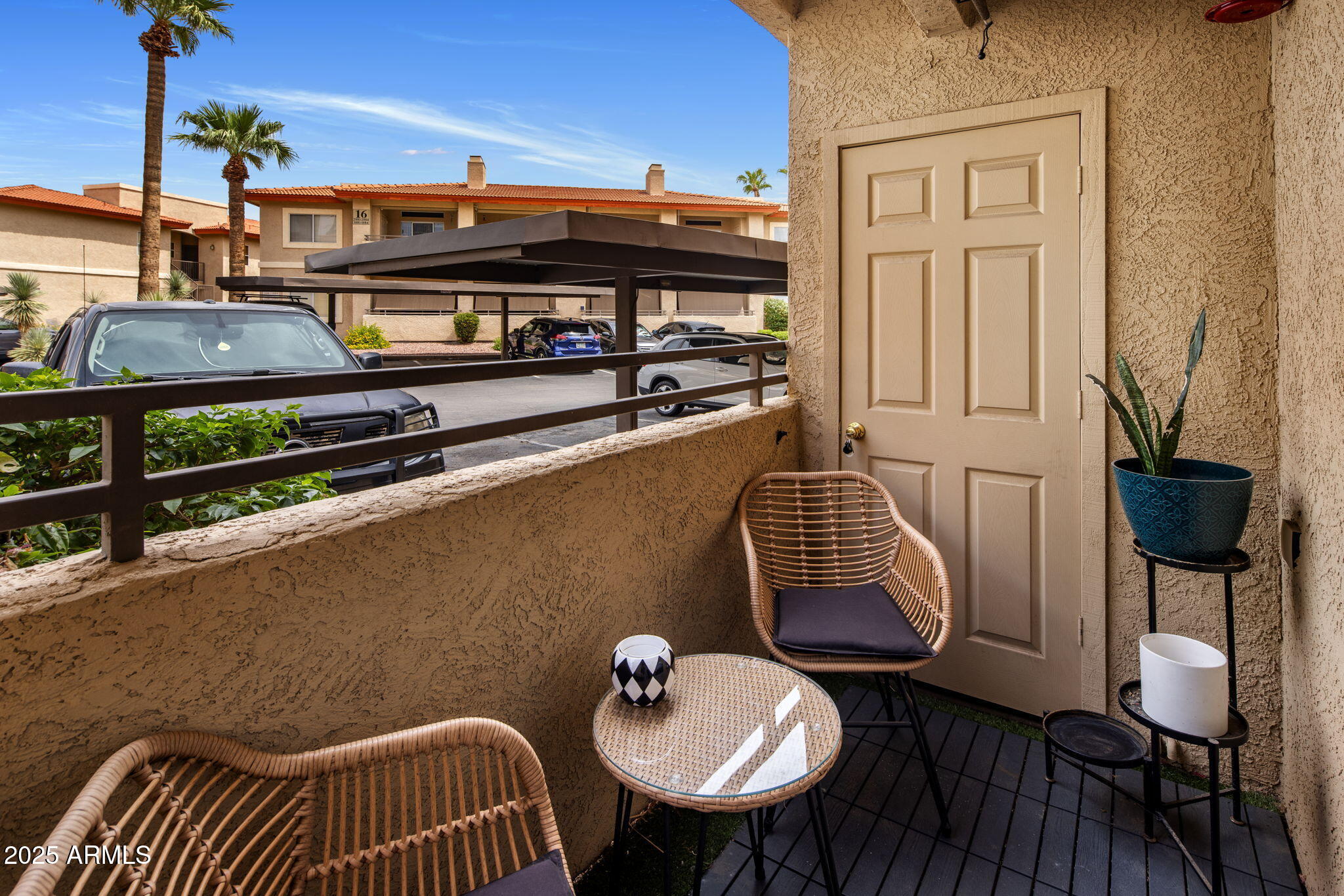 10410 North Cave Creek Road, Unit 1115 Phoenix, AZ 85020 - Photo 12 of 19 a balcony with table and chairs