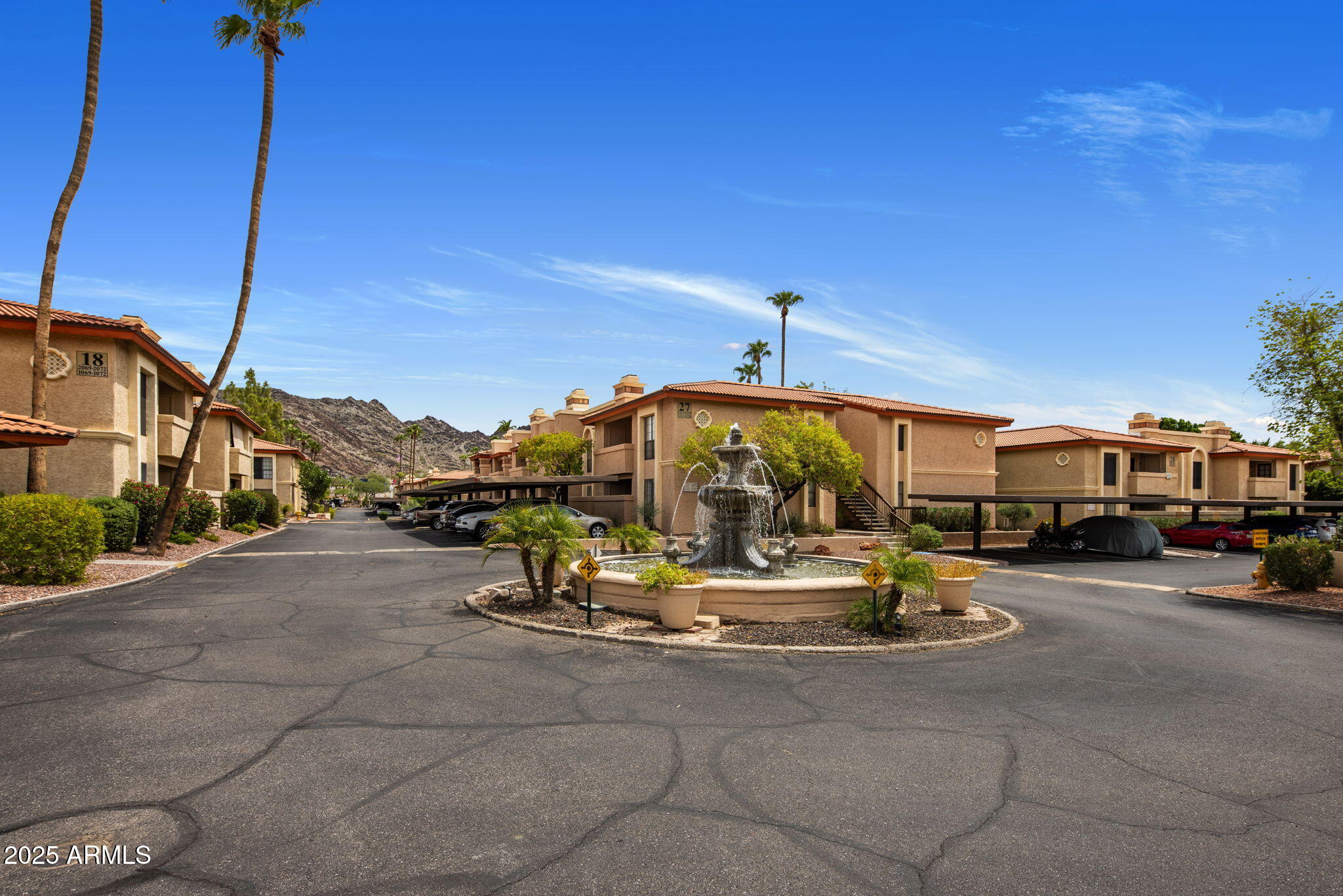10410 North Cave Creek Road, Unit 1115 Phoenix, AZ 85020 - Photo 18 of 19 a car parked in front of a building