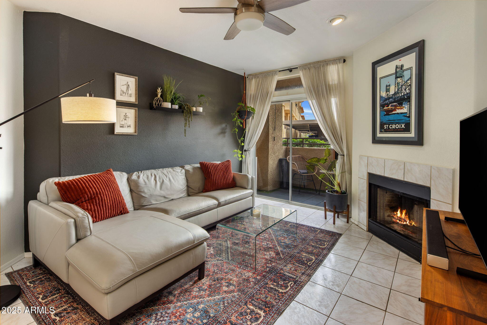 10410 North Cave Creek Road, Unit 1115 Phoenix, AZ 85020 - Photo 2 of 19 a living room with furniture and a fireplace