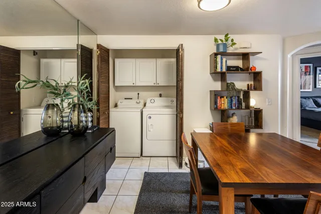 a kitchen with a table and chairs in it