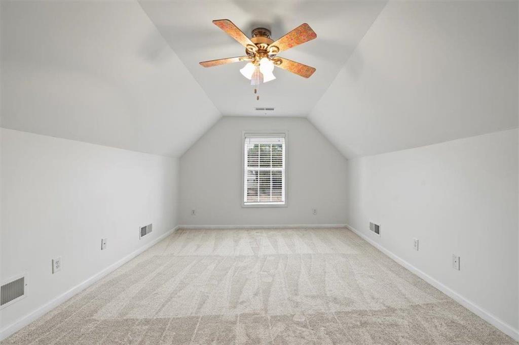 1218 Morgans Run Monroe, GA 30656 - Photo 19 of 39 wooden floor in an empty room with a window