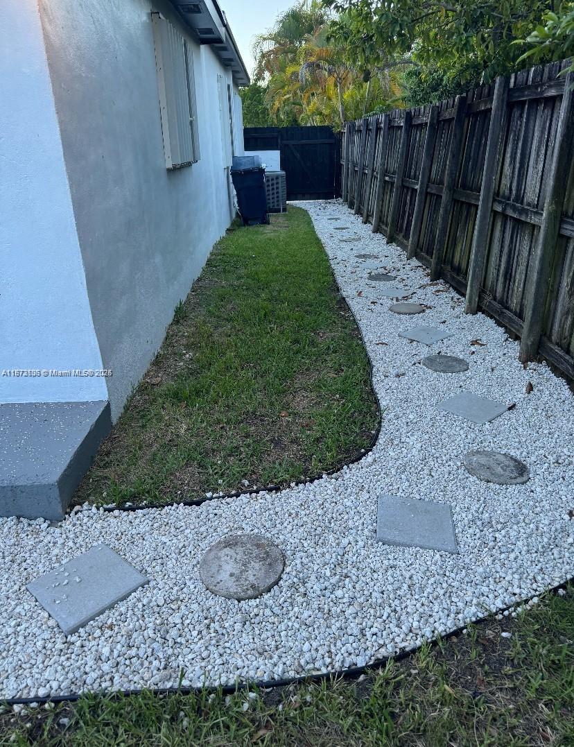 7390 Southwest 30th Terrace, Unit 2 Miami, FL 33155 - Photo 8 of 9 a view of a backyard with wooden fence